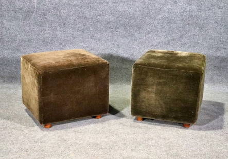 COMPANION PAIR MID CENTURY MODERN UPHOLSTERED OTTOMANS: Upholstered. Wood legs. 17 3/4" h x 20 3/4" w x 18 3/4" d.