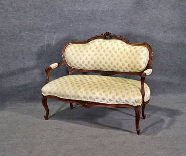 LOUIS XV STYLE CARVED SETTEE: Carved wood frame. Upholstered. 39 5/8" h x 48" w x 25 3/4" d. Seat height 18 3/4".