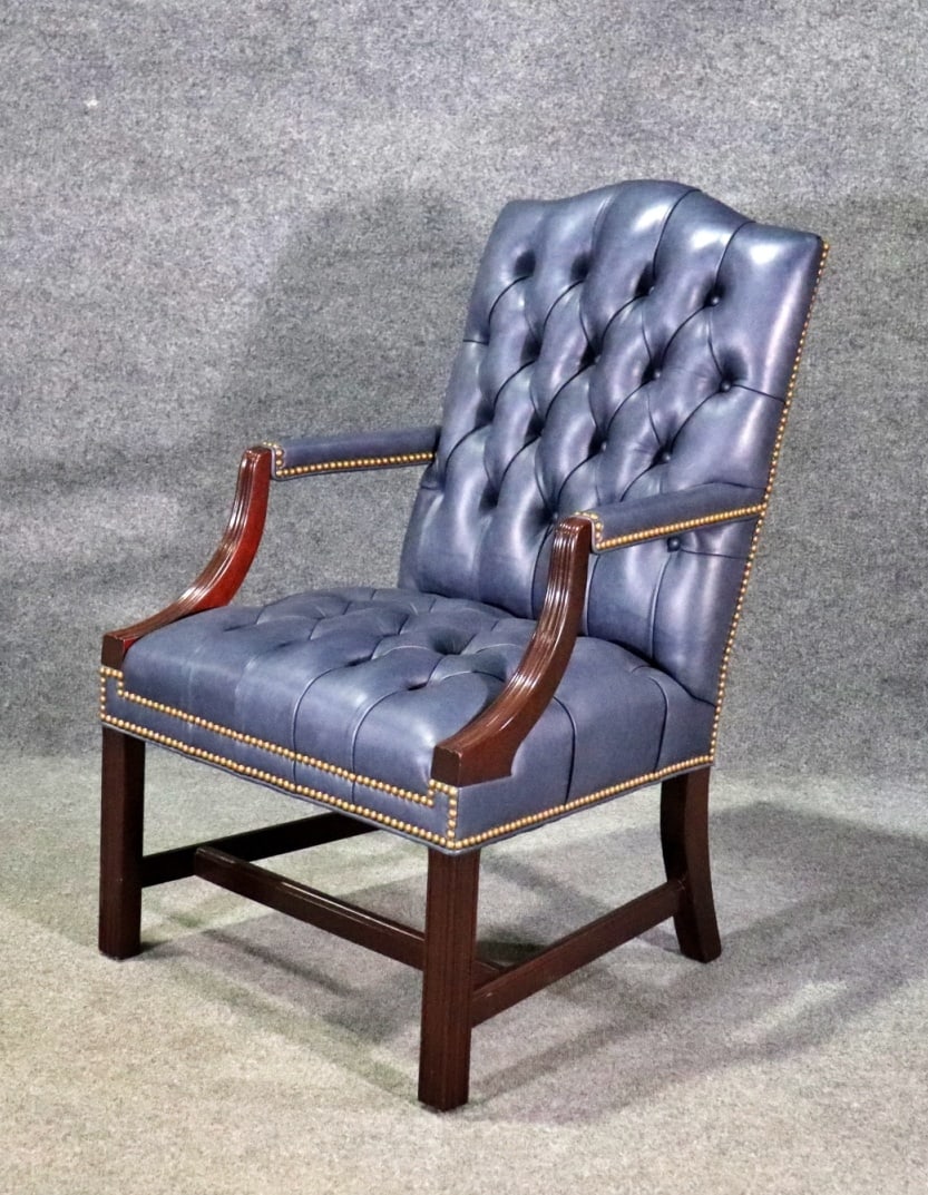 HANCOCK & MOORE LEATHER ARM CHAIR: Wood frame. Leather upholstery. Nail head trim. Tufted. 40 1/8" h x 25 5/8" w x 26 1/2" d. Seat height 19 1/2".
