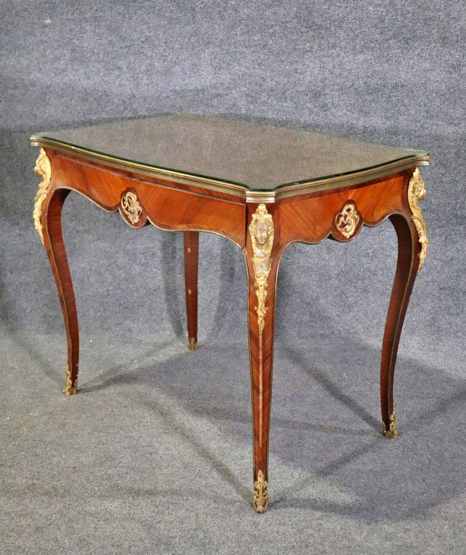 LOUIS XV STYLE MARQUETRY DESK: Bronze ormolu. Glass top. One dovetail drawer. 31 1/2" h x 38" w x 24" d.