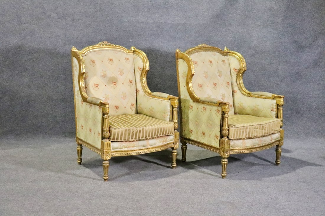 PAIR ANTIQUE LOUIS XVI STYLE GILT CARVED BERGERES: Gilt carved frames. Upholstered. 42 3/4" h x 28 1/2" w x 27" d. Seat height 17 1/4".