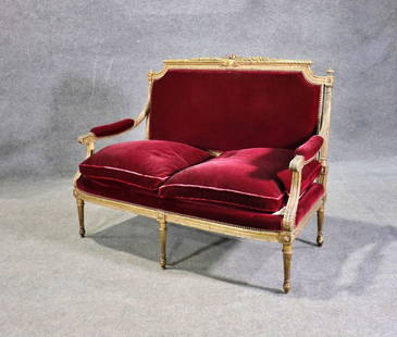 LOUIS XVI STYLE GILT SETTEE: Carved gilt frame. Upholstered. Nail head trim. 40 1/8" h x 53" w x 31" d. Seat height 22 1/2".