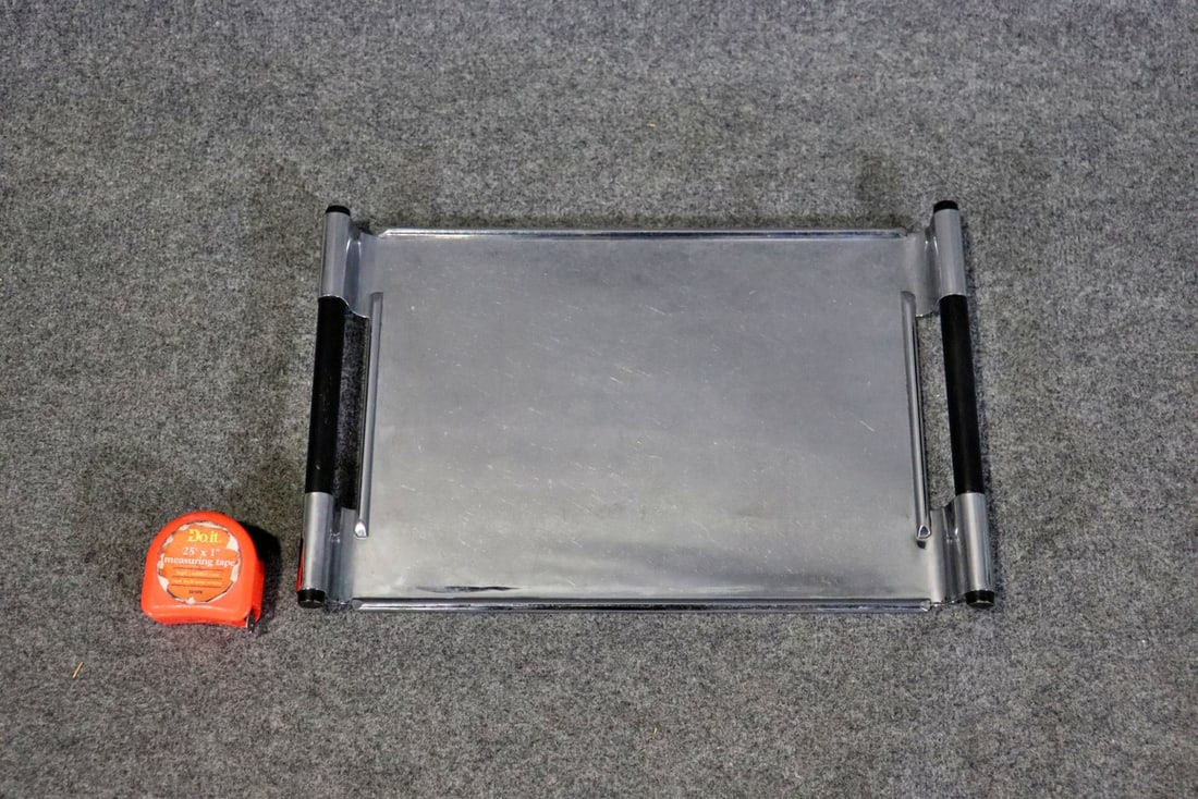 WALTER VON NESSEN CHROME PLATED TRAY: Chrome. Ebonized handles. 1 5/8" h x 18 5/8" w x 12 1/4" d.
