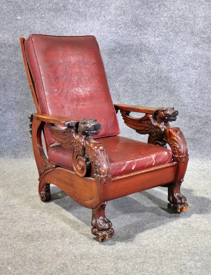WING GRIFFIN FIGURAL LEATHER MORRIS CHAIR: Carved. Figural. Leather. Adjustable back. 38 3/4" h x 28 3/4" w x 40 1/4" d. Seat height 16".