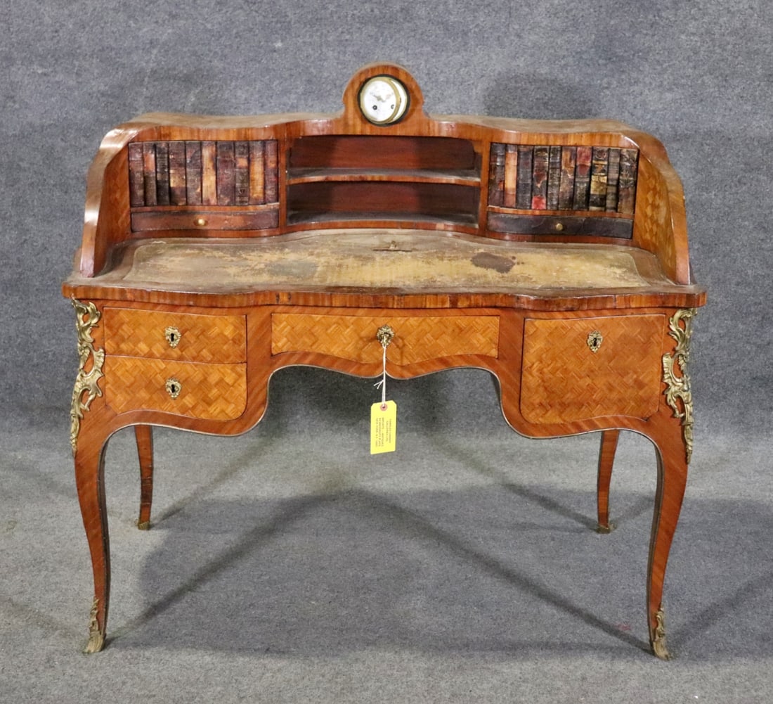 LOUIS XV STYLE BONHEUR DU JOUR WITH CLOCK: Inlaid marquetry. Bronze accents. With clock. 4 dovetailed drawers. 42 7/8" h x 45 1/4" w x 26" d.
