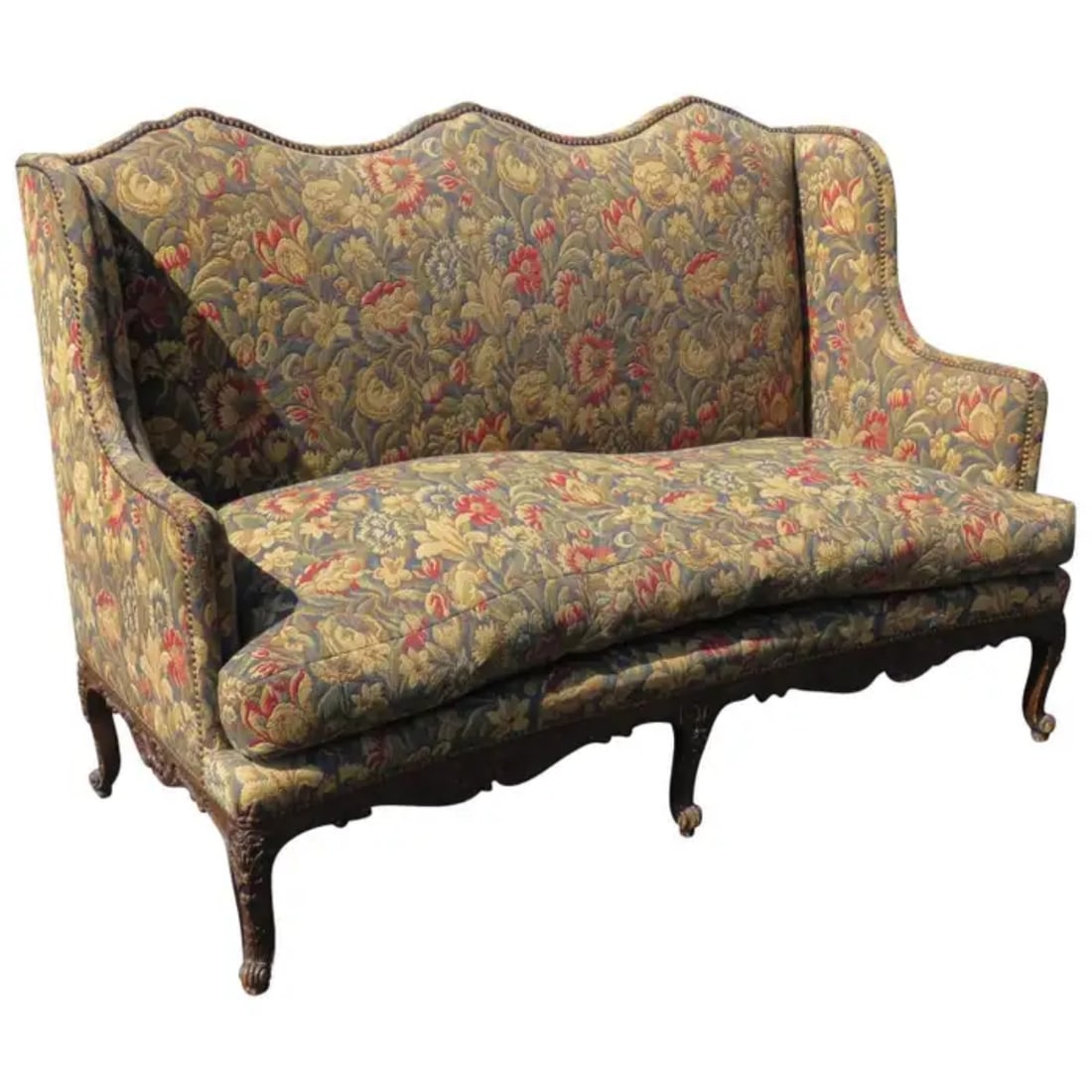 LOUIS XVI STYLE TAPESTRY UPHOLSTERED SOFA: Nail head trim. Carved. Walnut. Floral tapestry upholstery. 42" h x 61 1/2" w x 32" d.