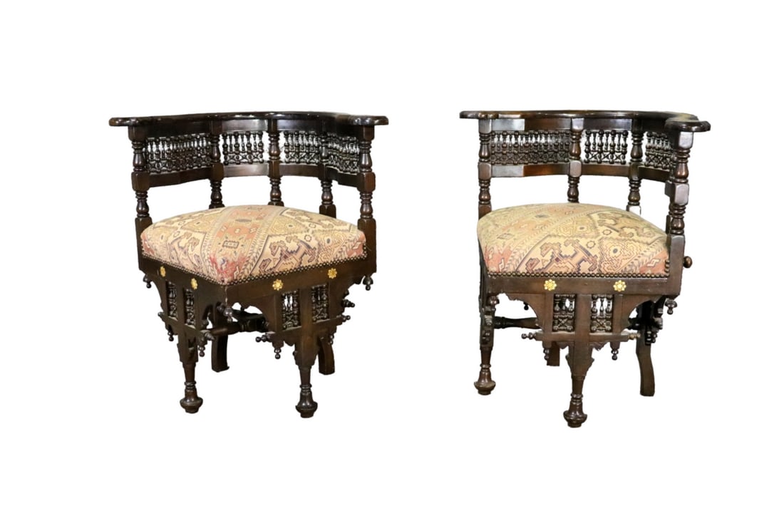 PAIR MOROCCAN CORNER CHAIRS: Mother of pearl inlay. Carved walnut. Upholstered seat. 30 3/4" h x 29 1/2" w x 27" d. 21 1/4" seat height.