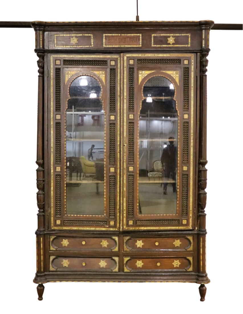MOROCCAN ARMOIRE: 2 doors on top containing 3 shelves. 4 drawers on bottom. Mother of pearl inlay. 97 3/4" h x 62 1/2" w x 24 3/8" d.