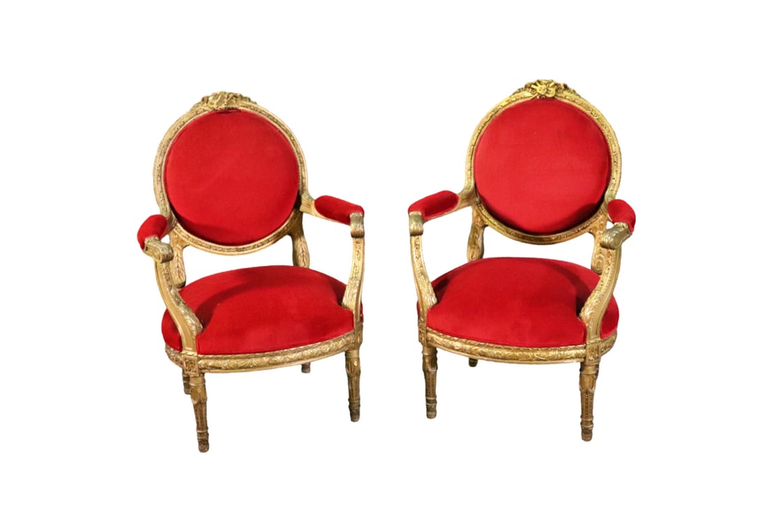 COMPANION PAIR LOUIS XVI STYLE CARVED GILT FAUTEUILS: Carved gilt frames. Upholstered seats, backs and arm rests. 43 1/2" h x 29 1/4" w x 30" d. Seat height 19 1/2" d.