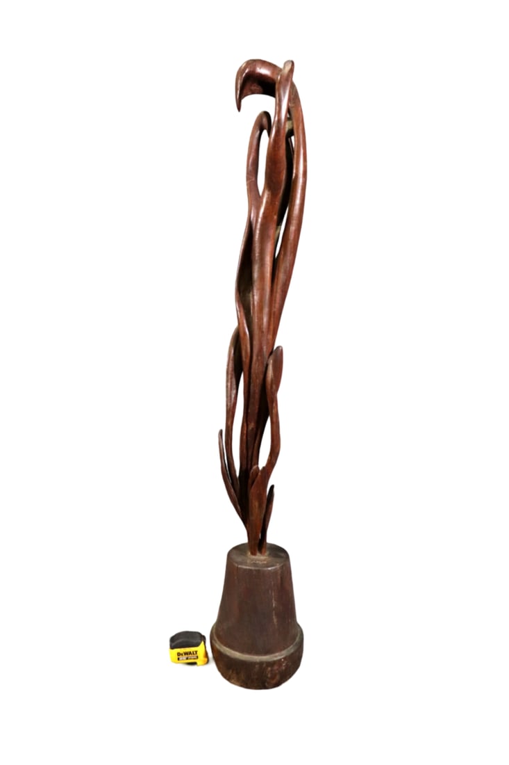 KAHAN LIGNUM VITAE WOOD SCULPTURE: Lignum vitae wood. 50 1/2" h x 8 1/2" w x 8 1/2" d.