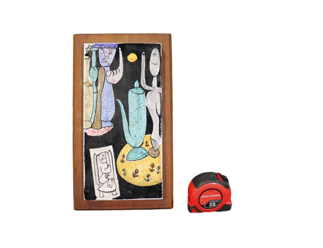 UNSIGNED PICASSO TILE: Tile on wood. Unsigned. Overall measures 14 1/4" h x 8" w x 1 1/2" d. Tile measures 12" h x 6" w x 5/8" d.