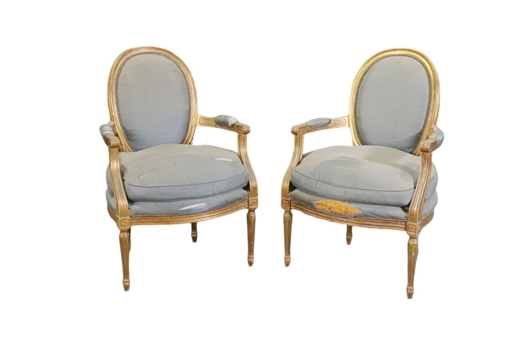 PAIR LOUIS XVI STYLE GILT FAUTEUILS: Gilt frames. Nail head trim. Upholstered arms, backs and seats. 35 3/4" h x 23" w x 19" d. Seat height 18 1/2" d.