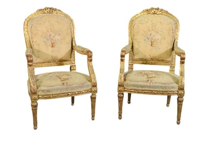 PAIR LOUIS XVI STYLE CARVED GILDED NEEDELPOINT FAUTEUILS