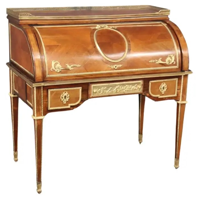 DORE BRONZE MOUNTED PUTTI WALNUT CYLINDER WRITING DESK WITH LEATHER: Walnut. Bronze mounted. Cherub or putti scenes. 1900's era. Leather. 43 3/4" h x 44 1/4" w x 25 1/2" d.