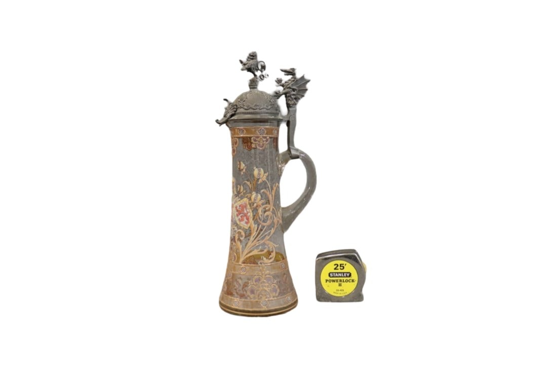 ARMORIAL GLASS TANKARD WITH PEWTER TOP: Glass. Pewter top. 16" h x 7" w x 5" d.