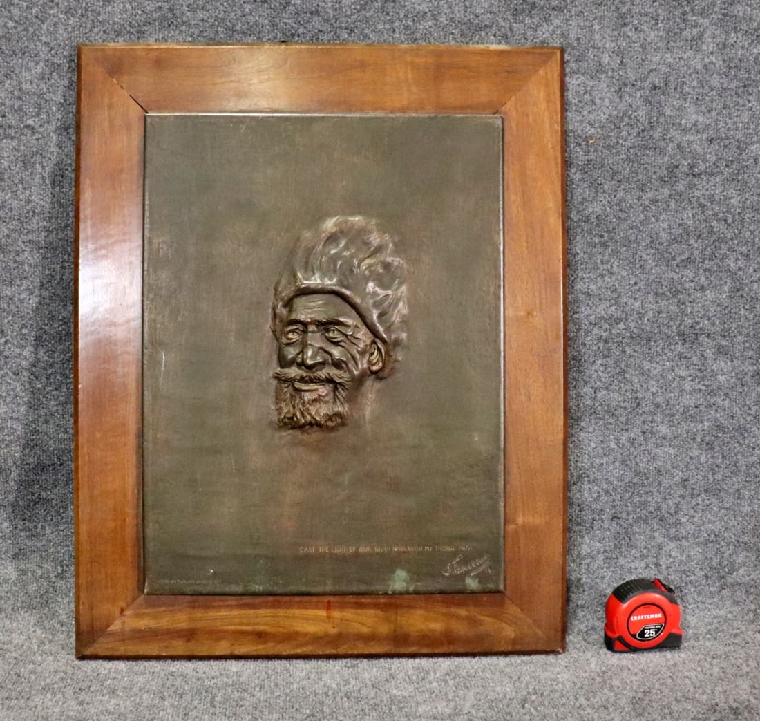 BRONZE PLAQUE ON WOOD FRAME: Bronze plaque on wood frame. Cast by Tiffany Studios NY on bottom left. On bottom right "Cast the light of your truth Nina upon my thorny path". Illegibly signed underneath. 27 1/2" h x 22" w x 1 1/4"