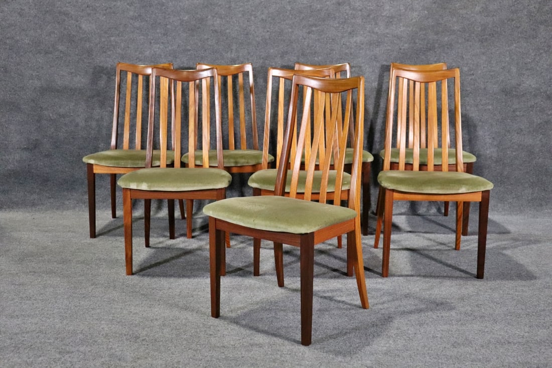 8 DANISH STYLE DINING CHAIRS: Danish style. Wood frames. Upholstered seats. 36" h x 19 1/4" w x 20" d. Seat height 17 1/2".