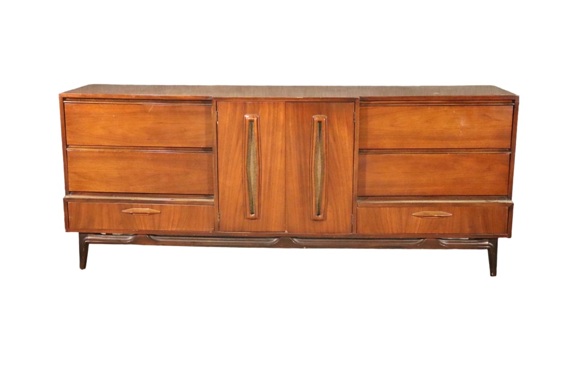 MID CENTURY MODERN WALNUT DRESSER: Walnut. 6 dovetailed drawer. 2 doors containing 3 dovetailed drawers. 32 3/4" h x 80" w x 21" d.