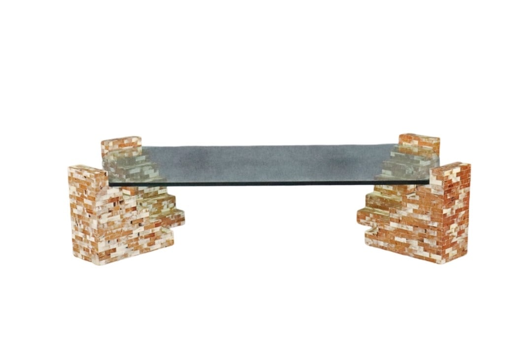 ENRIQUE GARCEL COFFEE TABLE: Made from horn and glass. Made in Columbia. Glass top. 5 pieces. 16" h x 68 1/4" w x 35 3/4" d.