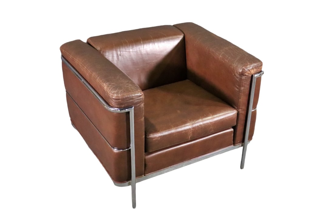 LEATHER CASSINA STYLE ARM CLUB CHAIR: Chrome frame. Leather upholstery. 26 5/8" h x 36 3/8" w x 31 1/4" d. Seat height 17".