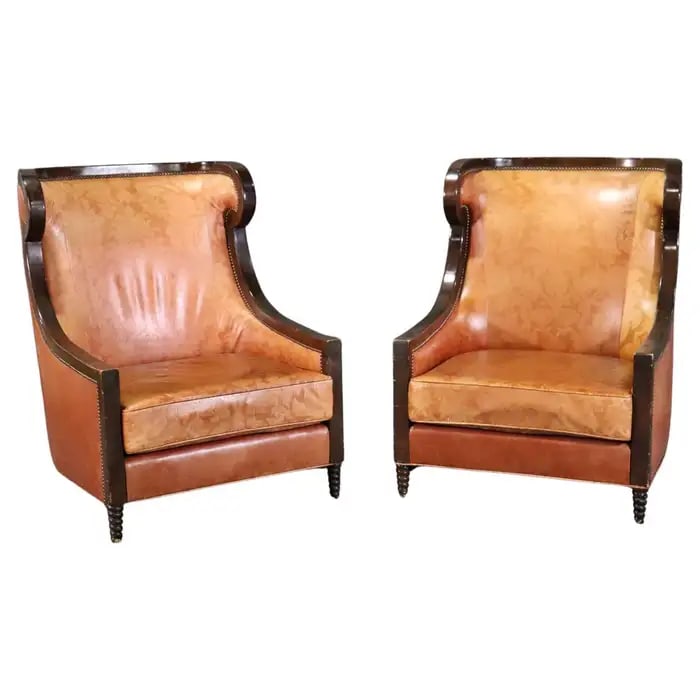 PAIR LEATHER BERGERES: Leather upholstery. Wood frames. Nail head trim. 43 3/4" h x 32 1/2" w x 34" d. Seat height 17".