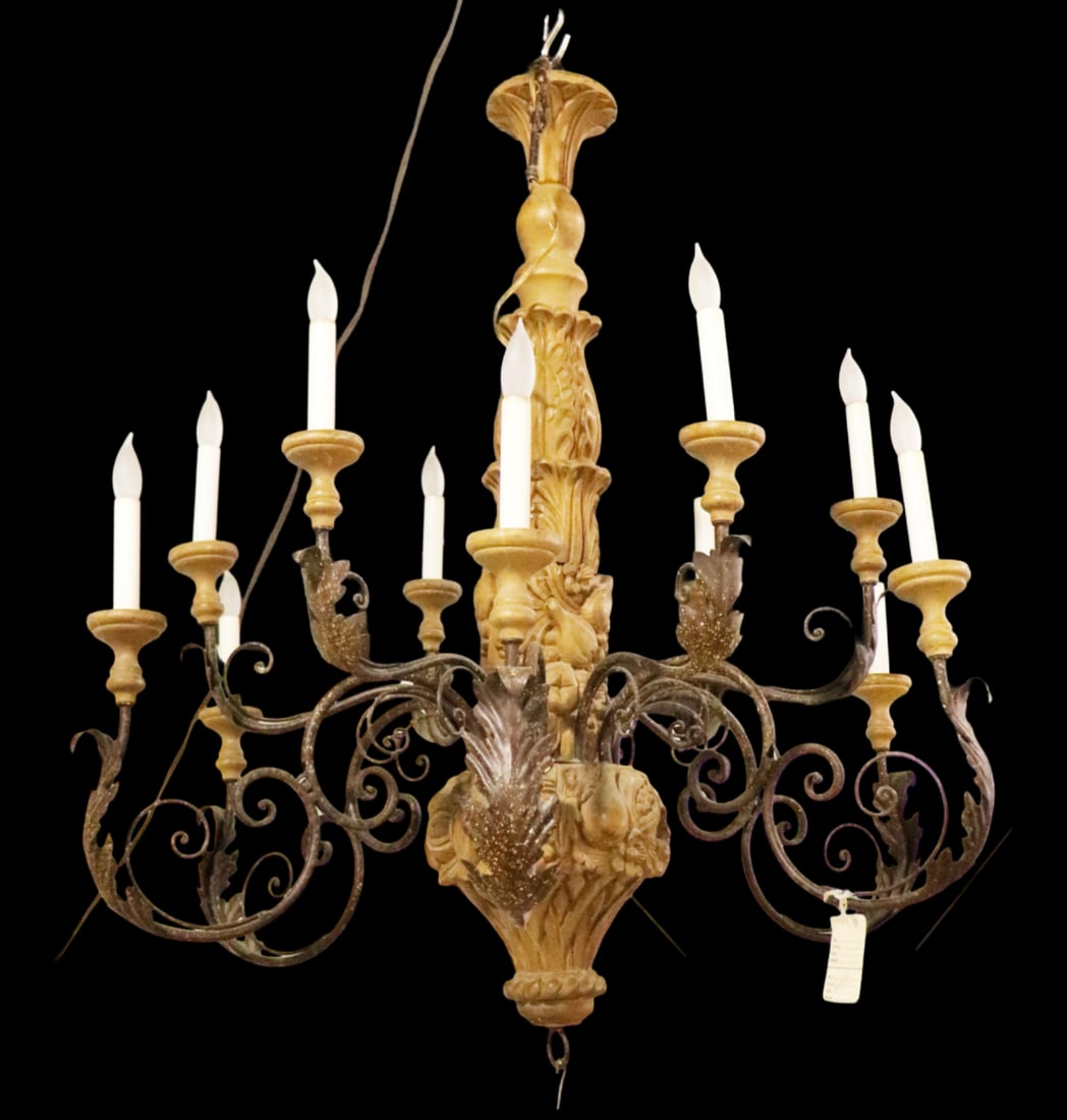ANTIQUE ITALIAN 12 ARM CHANDELIER: Carved wood. Metal. 12 arms. 39" h x 35" diameter.