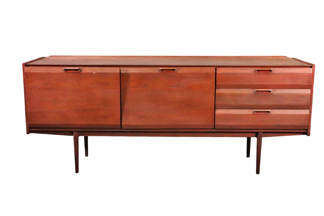 MODERN TEAK SIDEBOARD: Teak. With backsplash. One drop down door on left containing 1 shelf. 1 door in center containing 1 shelf. 3 drawers, 29 3/8" h x 72" w x 18 1/2" d.