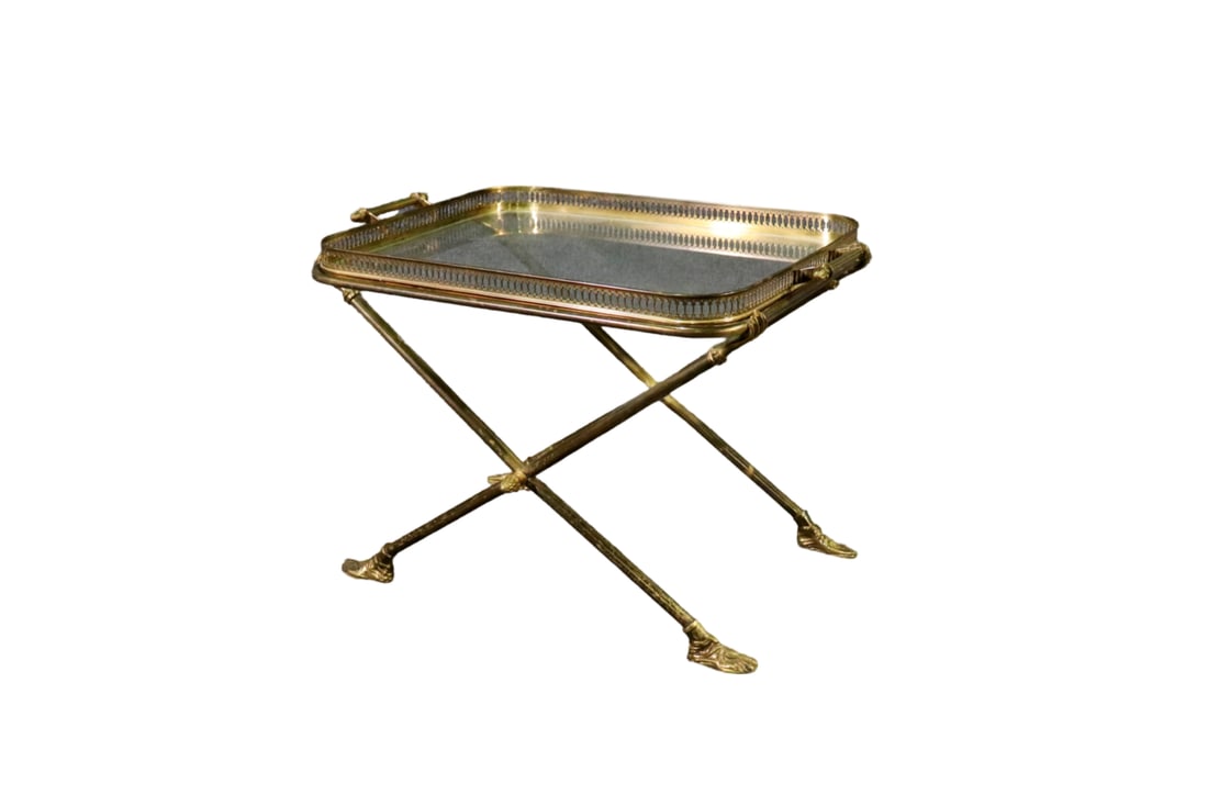 ANDRE ARBUS ATTRIBUTED VINTAGE BRASS & GLASS COFFEE TABLE: Brass frame. Glass top. Foot and hand figural.18" h x 24 1/2" w x 16 1/2" d.
