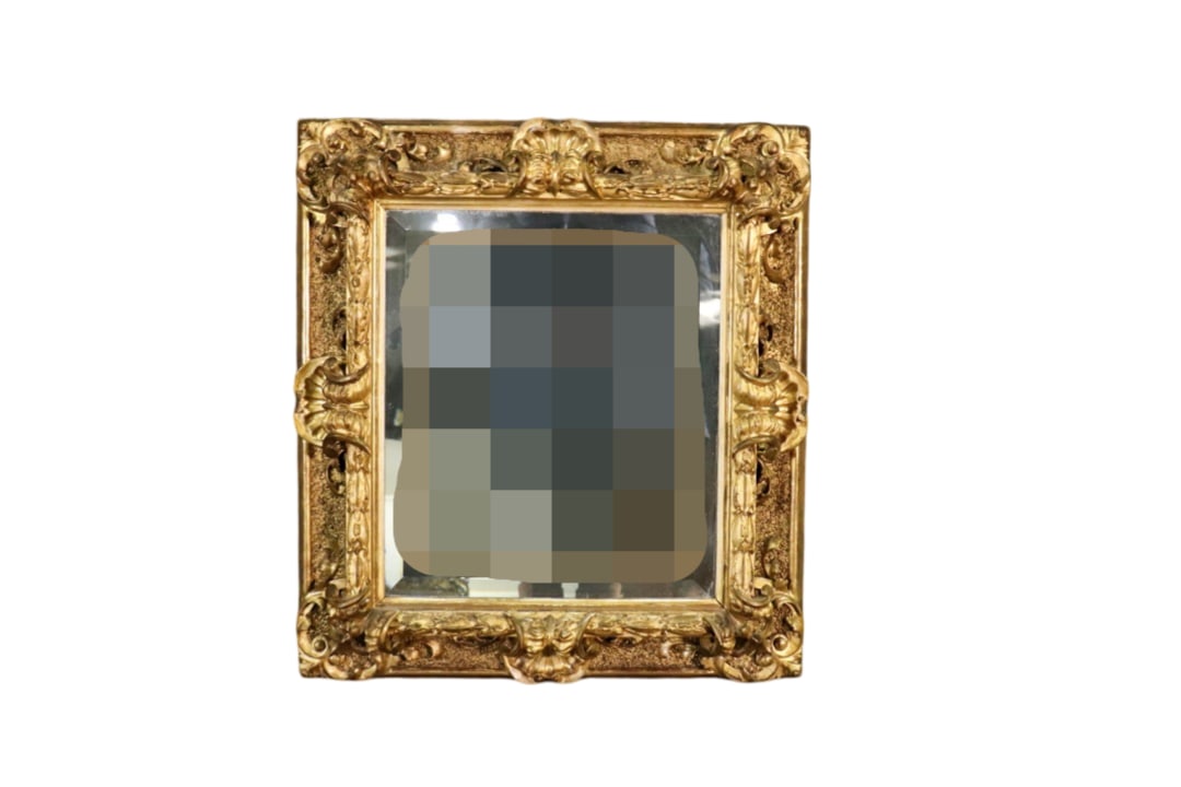 CARVED GILT WOOD MIRROR: Carved gilt wood. Beveled glass. 32" h x 28' w x 4" d.