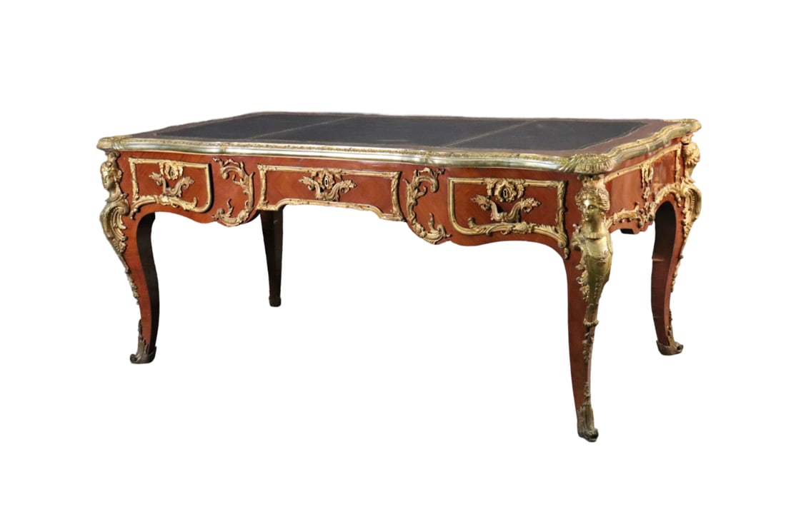 LOUIS XV STYLE FIGURAL LEATHER TOP BUREAU PLAT: Leather top. Figural. Bronze accents and figures. 3 dovetailed drawers. 31" h x 70 1/2" w x 37 1/2" d.