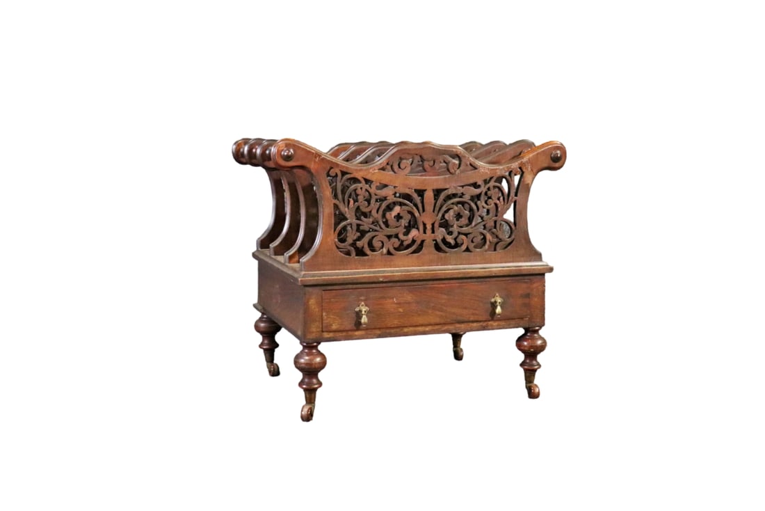ENGLISH VICTORIAN CARVED MAHOGANY CANTEBURY: Mahogany. Carved. On casters. 1 dovetailed drawer. Metal hardware. 20 1/4" h x 23 7/8" w x 16" d.