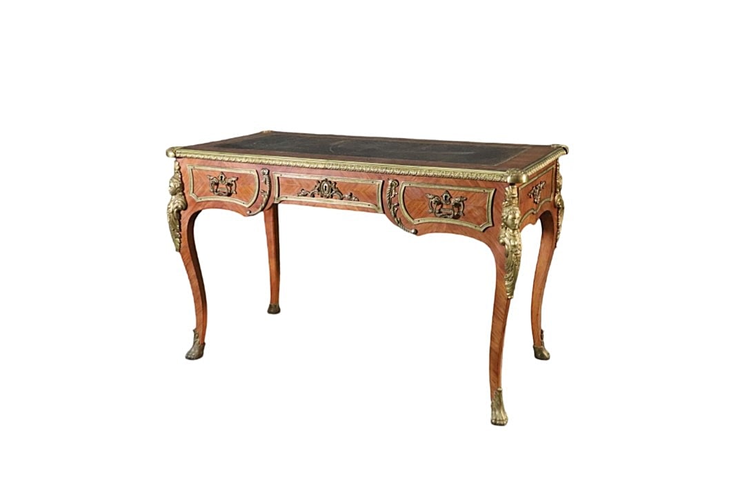 LOUIS XV STYLE LEATHER TOP BUREAU PLAT: Leather top. Bronze figural accents. Bronze feet. 3 dovetailed drawers. 30" h x 47 3/4" w x 24 3/4" d.