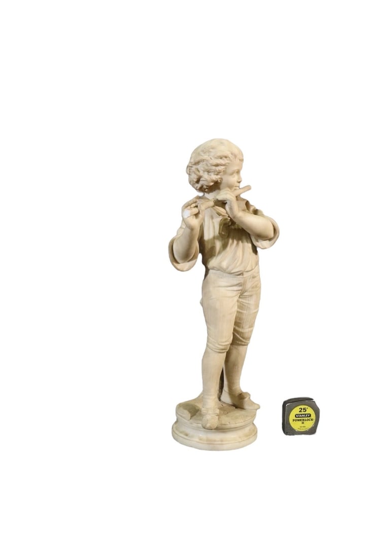 CARVED ALABASTER SCULPTURE BOY PLAYING FLUTE: Alabaster. 35 5/8" h x 8 1/4" w x 8 1/2" d.