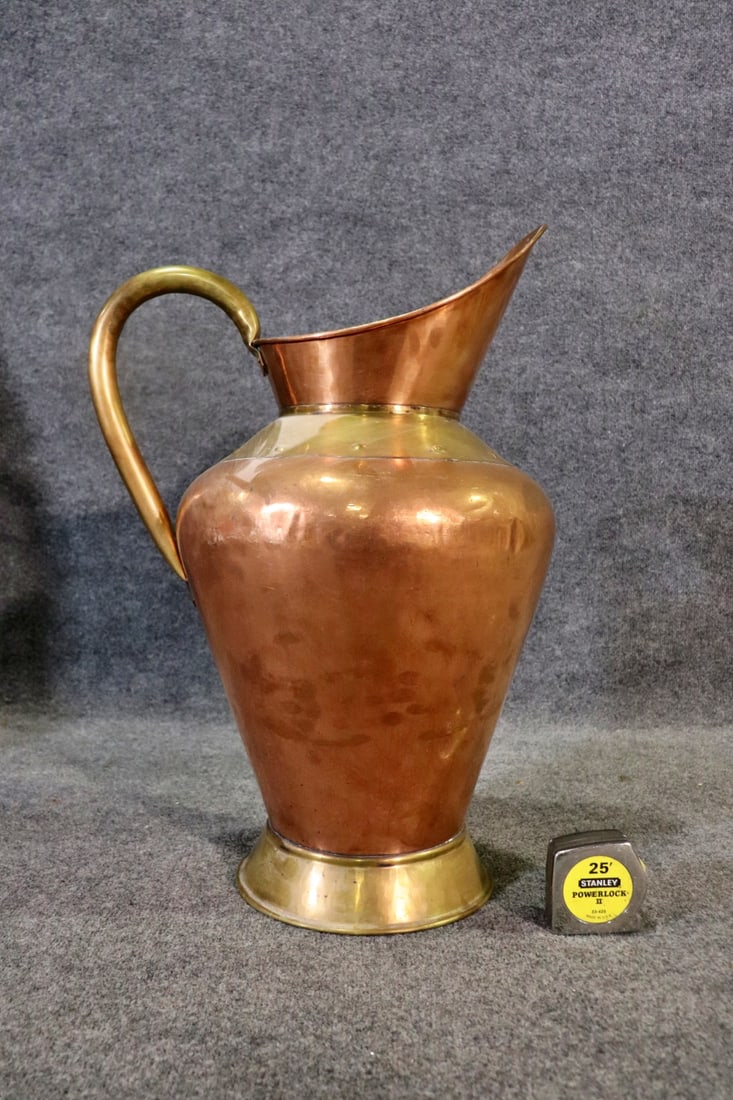 COPPER & BRASS PITCHER: Copper. Brass. 24 3/4" h x 16" w x 13" d.