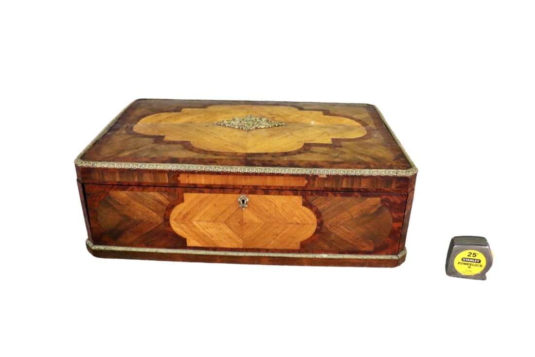INLAID & BRASS WRITING DESK: Inlaid. Brass accents. 1 flip down door containing 2 drawers. 8" h x 26" w x 18 1/4" d.