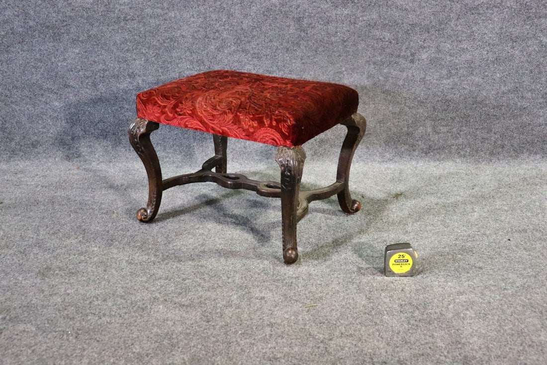 FRENCH CARVED BENCH: Carved wood frame. Upholstered seat. 16 1/2" h x 22 " w x 17 1/4" d.