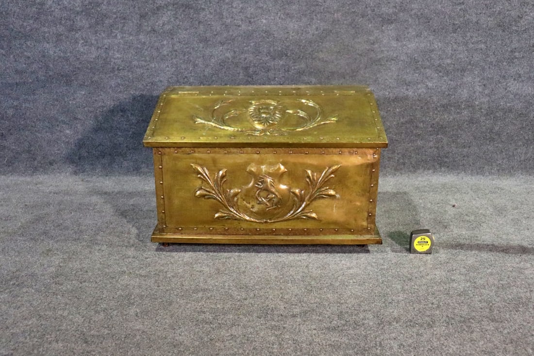 CARVED BRASS TRUNK: Brass. Carved. Flip up lid. 2 handles. Nail head trim. 20 1/4" h x 32" w x 18 7/8" d.