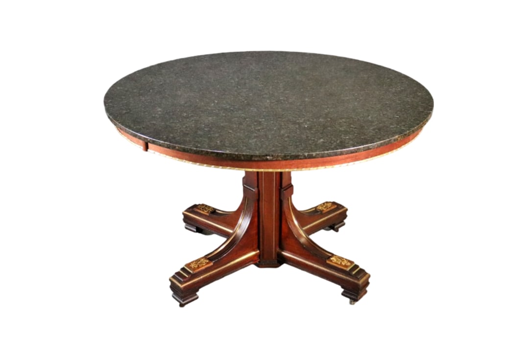 BALTIC STYLE BRASS BOUND MARBLE TOP CENTER TABLE: Brass accents. Granite top. 31" h x 48" diameter.