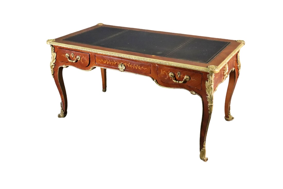 LOUIS XV STYLE LEATHER TOP BUREAU PLAT: Bronze accents and hardware. Leather top. 3 dovetailed drawers. 30 1/8" h x 39" w x 30 1/2" d.