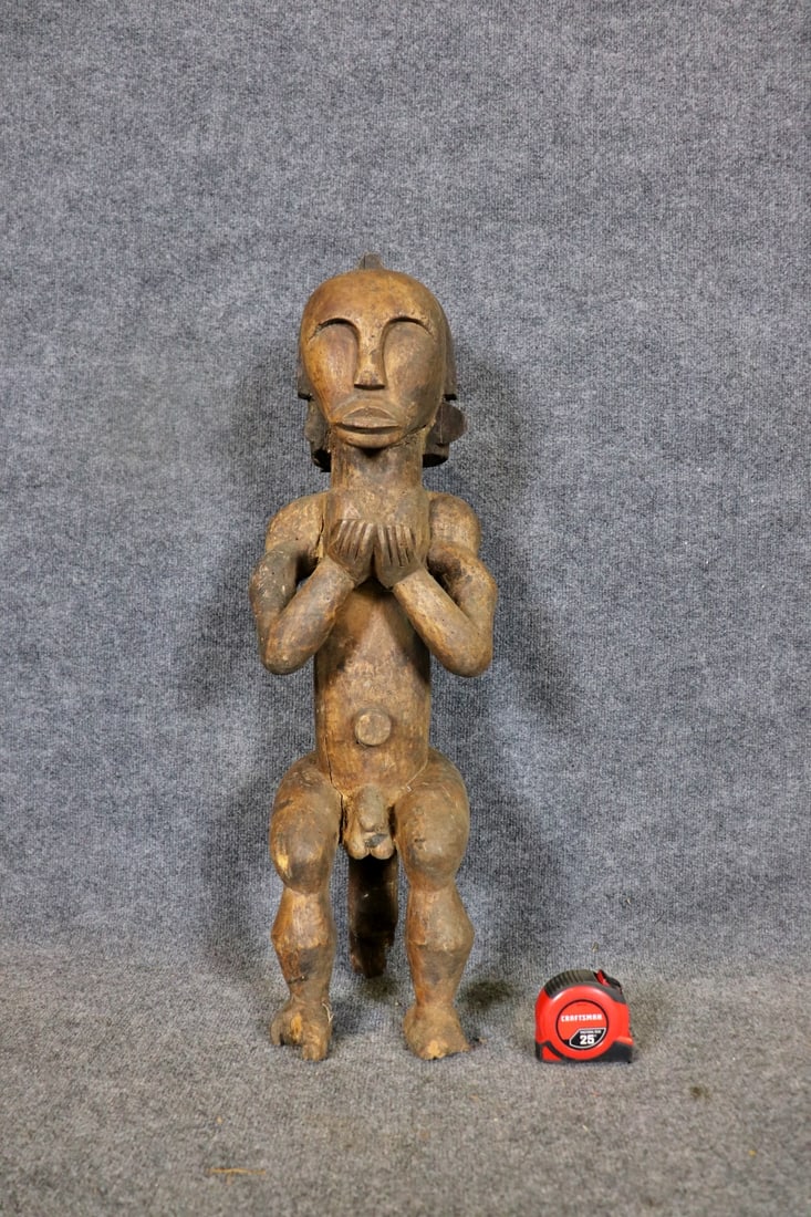 CARVED AFRICAN SCULPTURE: Carved. 30" h x 9 3/4" w x 8 1/2" d.