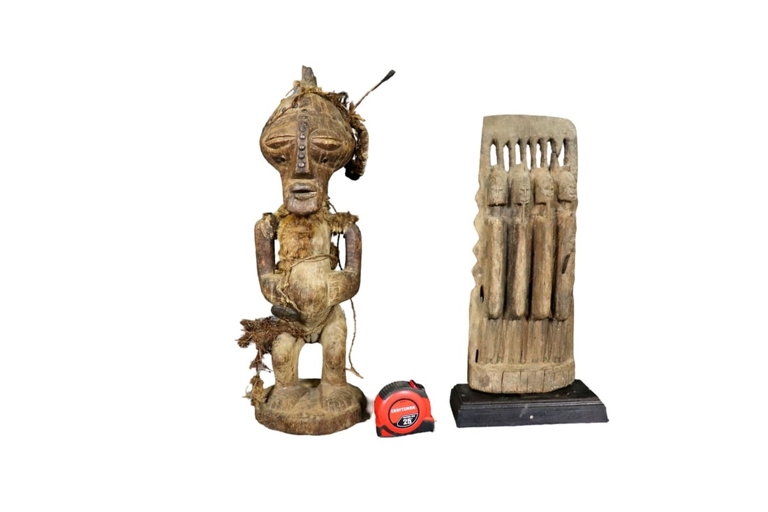 2 CARVED AFRICAN SCULPTURES: Carved wood. One measures 22 1/2" h x 7 1/2 "w x 7" d. One measures 19" h x 9 1/4" w x 4 1/2" d.