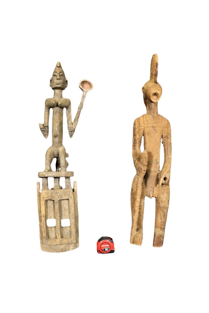 2 CARVED AFRICAN SCULPTURES: Carved wood. One measures 39" h x 13" w x 6 1/2" d. One measures 37" h x 8 1/2" w x 8 1/2" d.