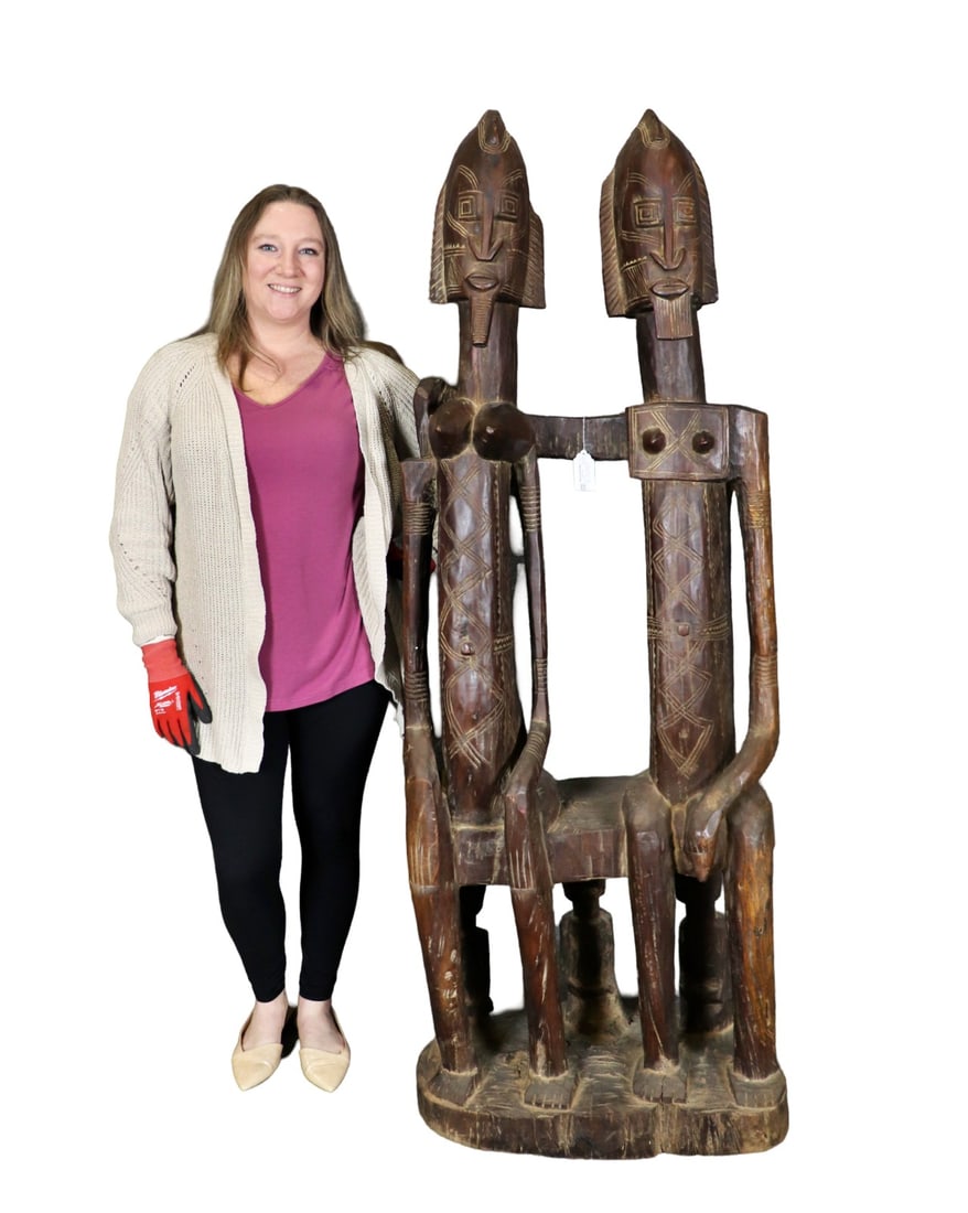 CARVED AFRICAN SCULPTURE MAN & WOMAN: Carved wood. 68" h x 29" w x 17" d.