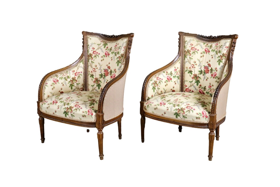 PAIR LOUIS XVI STYLE CARVED BERGERES: Carved wood frames. Upholstered. 36 5/8" h x 26 3/8" w x 23" d. Seat height 16".