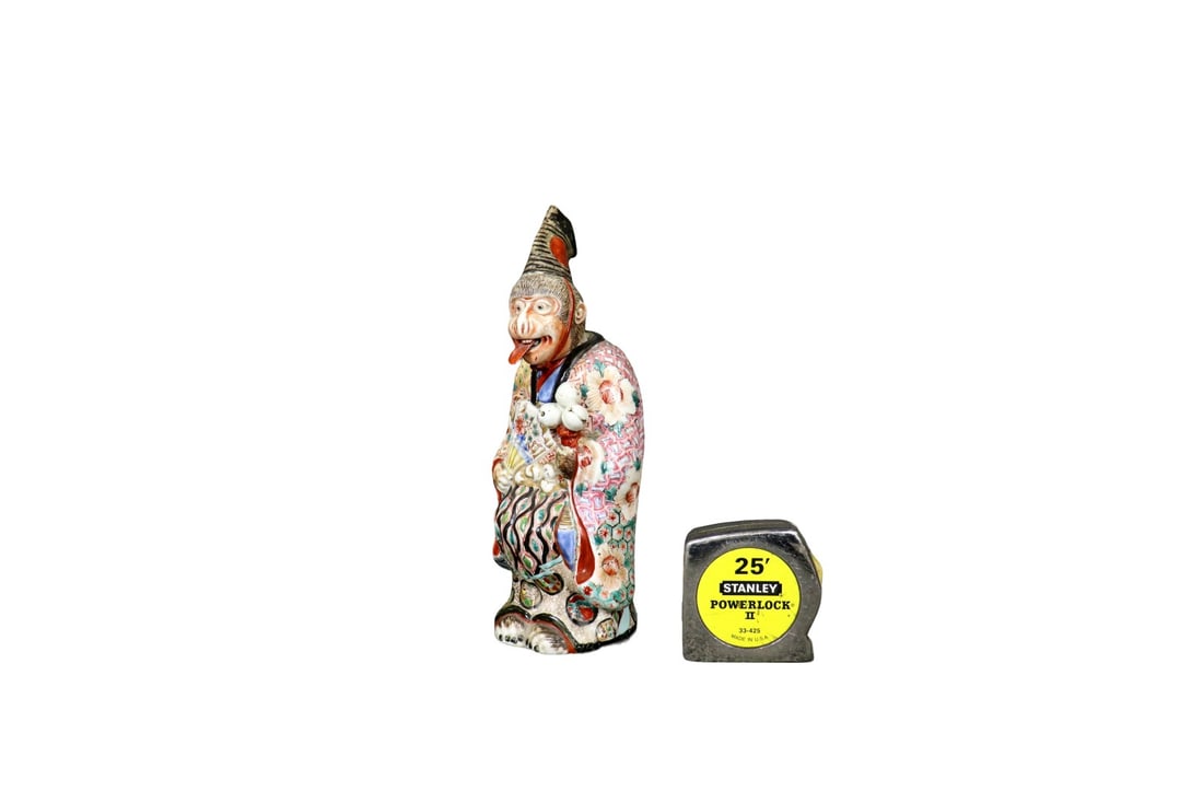 FAMILLE ROSE OKIMONO DECORATIVE SCULPTURE: Porcelain. Painted. Free floating head and tongue. 10 1/2" h x 3 1/4" w x 4" d.