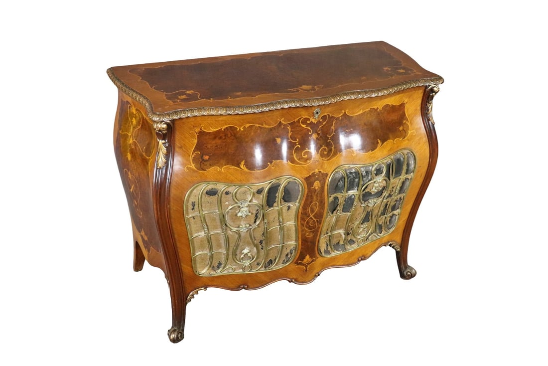 FRENCH INLAID BOMBAY TRUNK: Inlaid. Gilt accents. Bronze mounts. Bronze trim. 36 3/4" h x 48 3/4" w x 23" d.