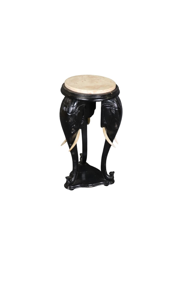 MARBLE TOP ELEPHANT FIGURAL PEDISTAL: Marble top. Ebonized. Elephant figural. Wood tusks. 31" h x 16" diameter.