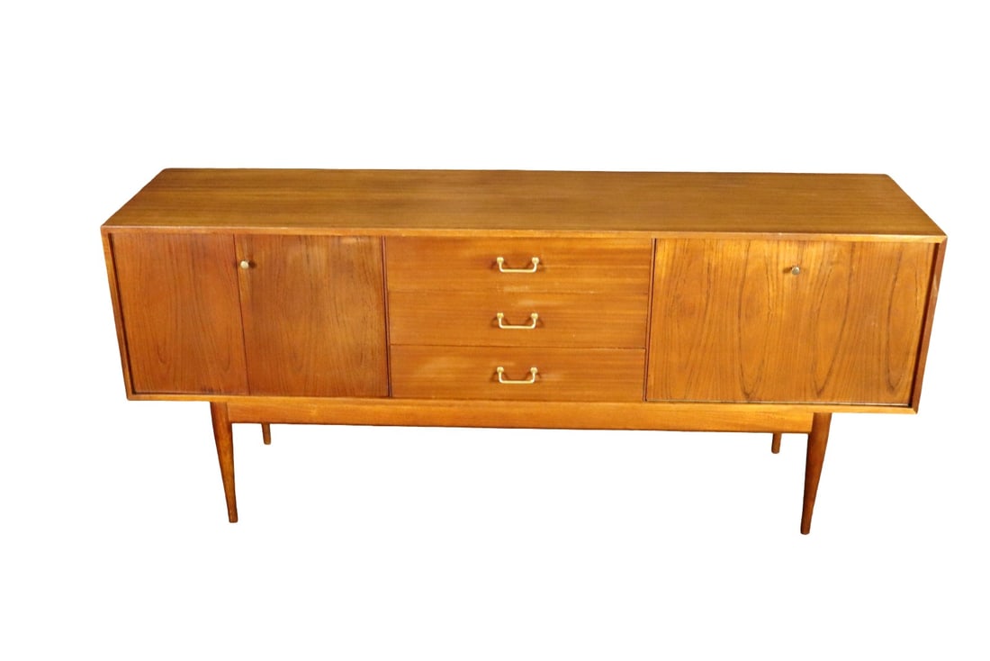 MID CENTURY MODERN SIDEBOARD/BAR: 3 drawers in middle. Door on left contains one shelf. Drop down door on right contains one shelf. 31 1/8" h x 72" w x 18 1/4" d.