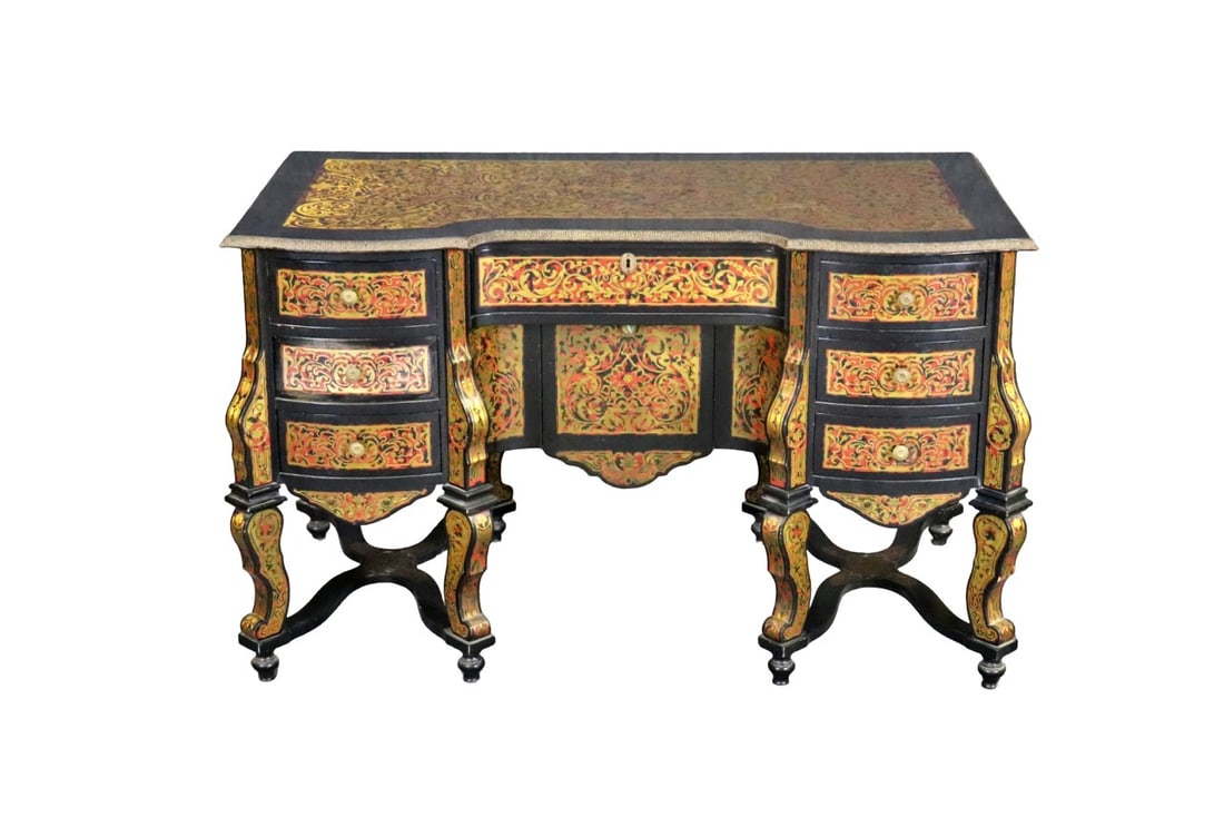 ITALIAN BRASS INLAID BRONZE MOUNTED DESK: Brass inlay. Bronze mounts. 7 dovetail drawers. Drop down door in middle. 31 1/4" h x 53 1/4" w x 29 1/4" d.