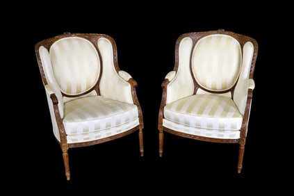 PAIR LOUIS XVI STYLE CARVED WALNUT BERGERES